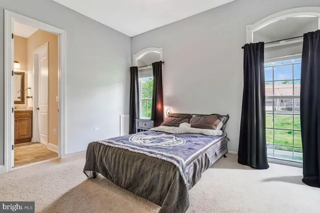 a bedroom with a bed and furniture