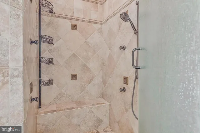 a bathroom with a tub sink and a window