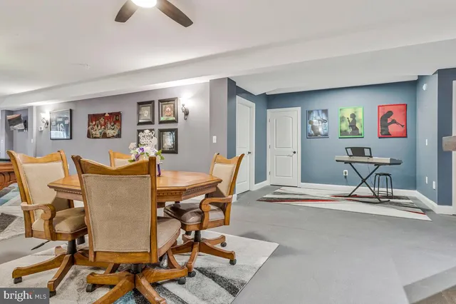 a living room with furniture a rug and a window