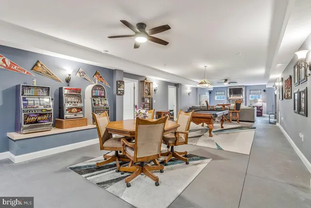 a living room with furniture fireplace and a window