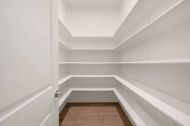 a kitchen with stainless steel appliances granite countertop a sink refrigerator and cabinets