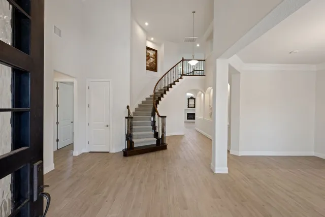 a view of entryway with stairs and wooden floor