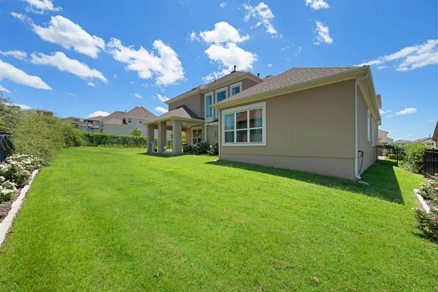 a front view of a house with a yard and porch