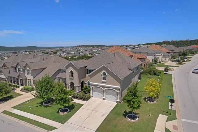 an aerial view of a house with a garden