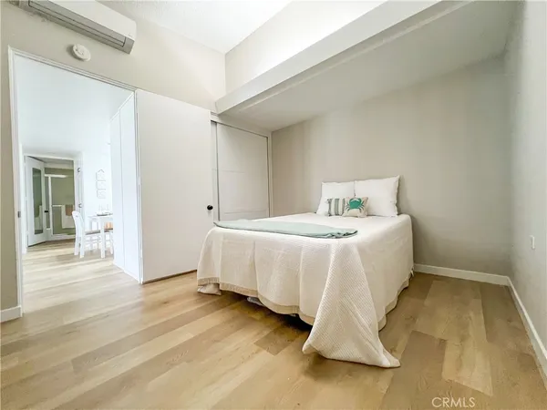 a bedroom with a bed and a table