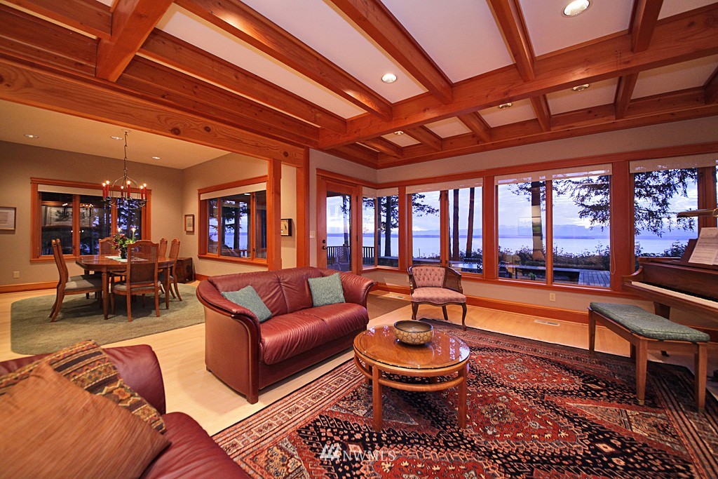 6966 Sills Road Clinton, WA 98236 - Photo 12 of 25 a living room with furniture a ceiling fan and a rug