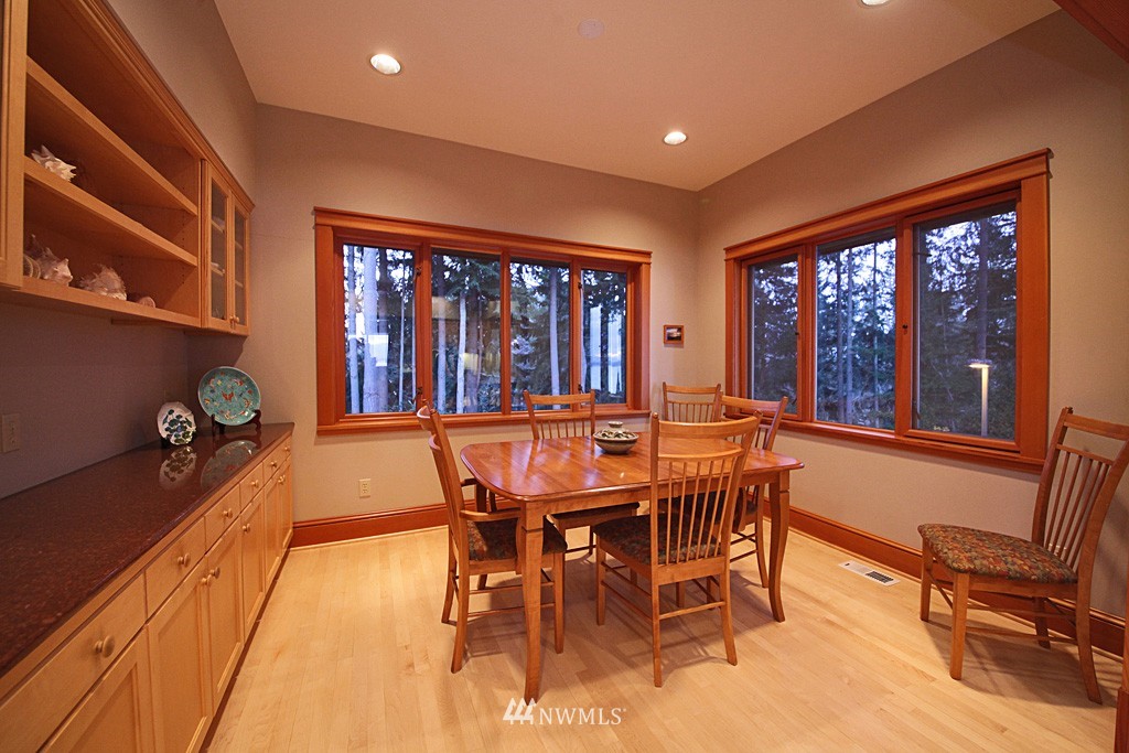 6966 Sills Road Clinton, WA 98236 - Photo 14 of 25 a view of a dining room with furniture window and outside view