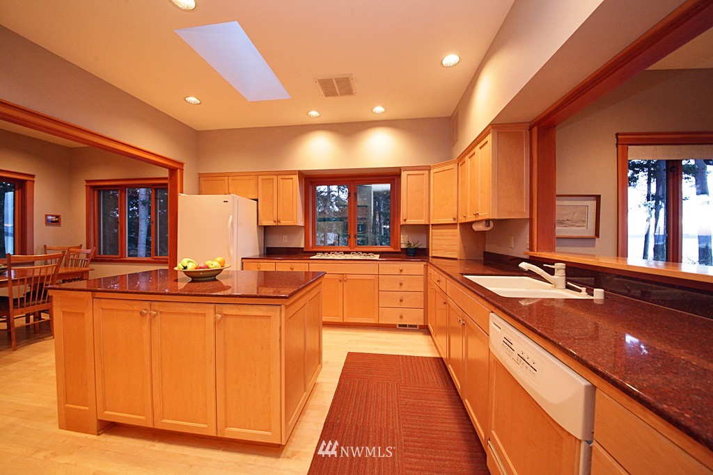 6966 Sills Road Clinton, WA 98236 - Photo 16 of 25 a large kitchen with lots of counter space and a sink
