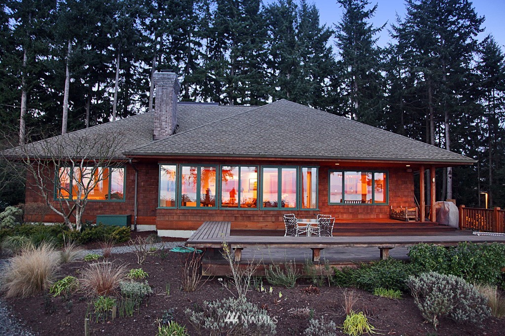 6966 Sills Road Clinton, WA 98236 - Photo 3 of 25 a backyard of a house with yard and outdoor seating