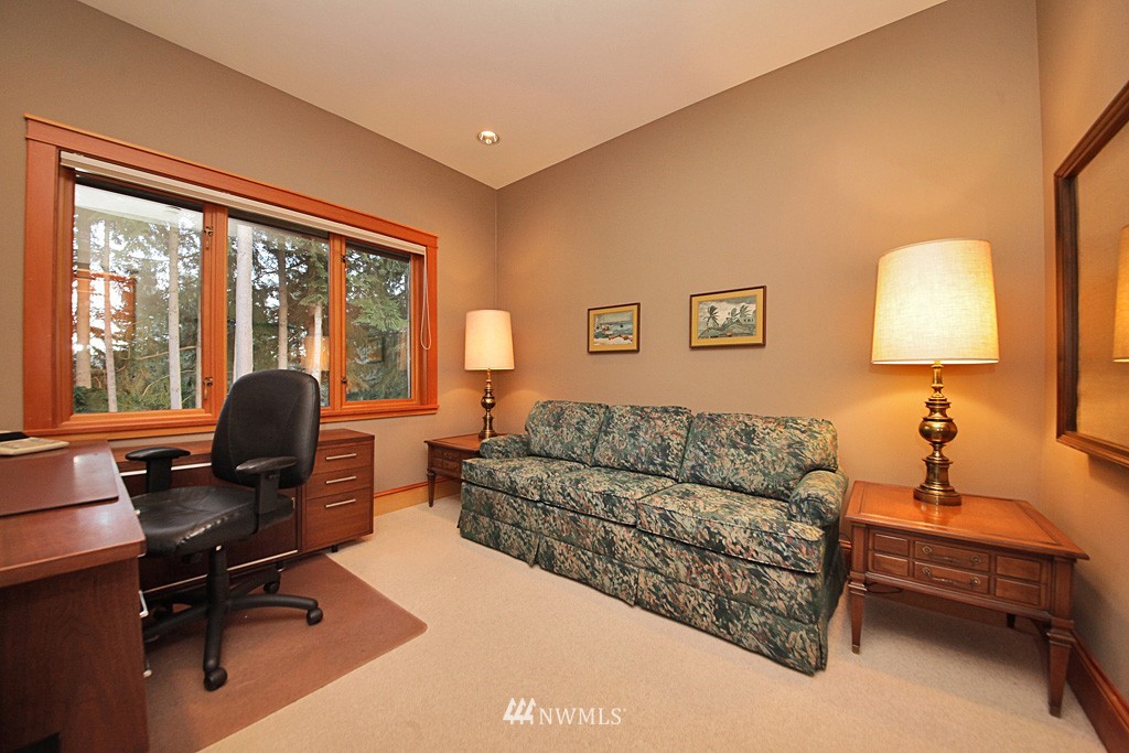 6966 Sills Road Clinton, WA 98236 - Photo 22 of 25 a living room with furniture and a large window