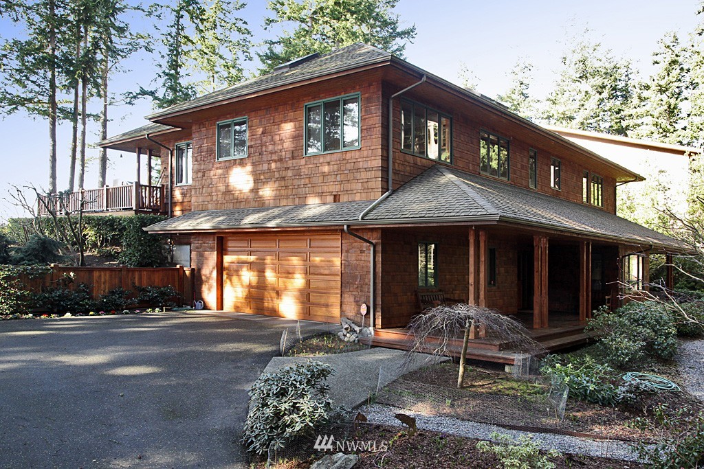 6966 Sills Road Clinton, WA 98236 - Photo 5 of 25 a front view of a house with a yard