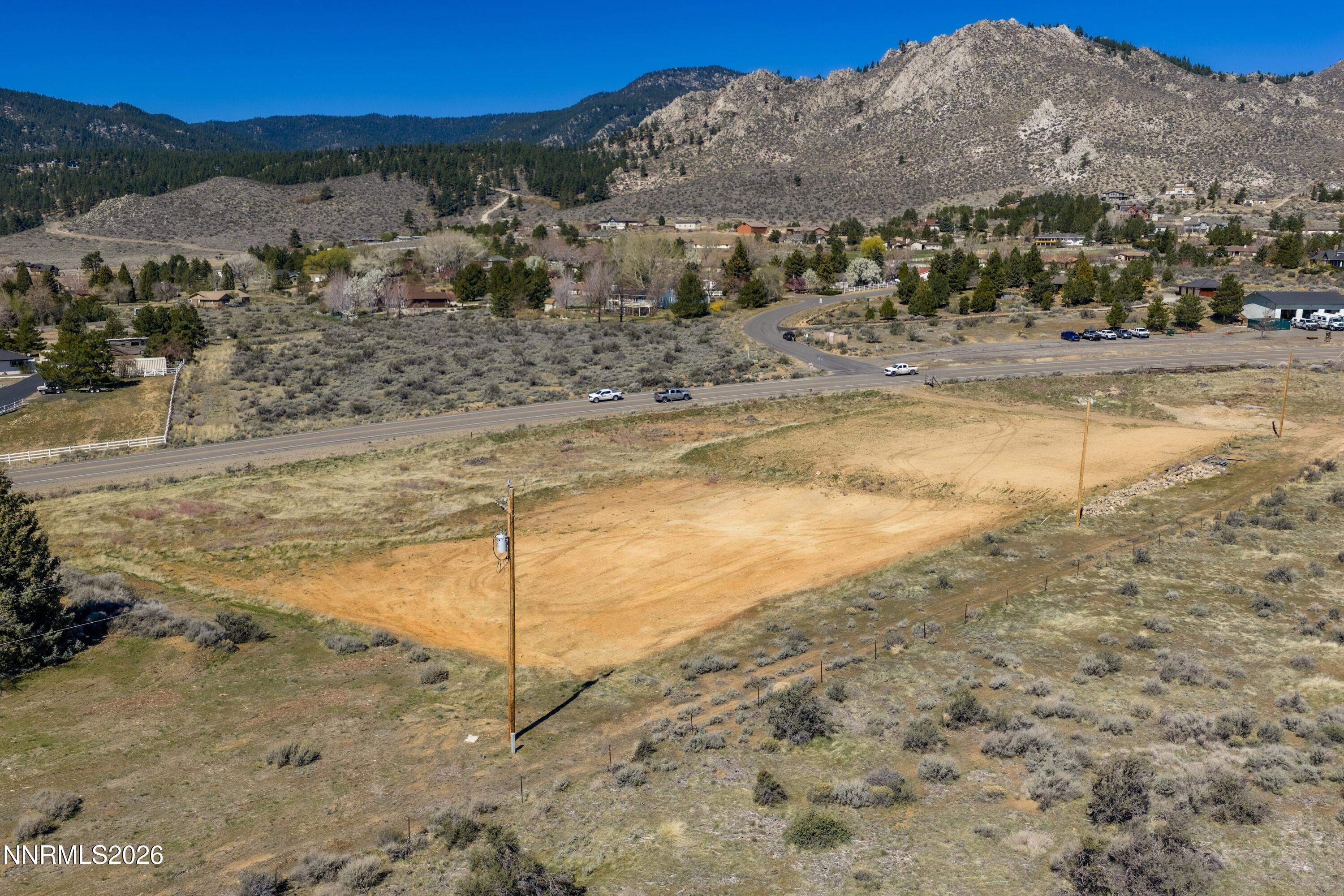 3447 Jacks Valley Road Carson City, NV 89705 - Photo 11 of 15 a view of a dry yard with mountain