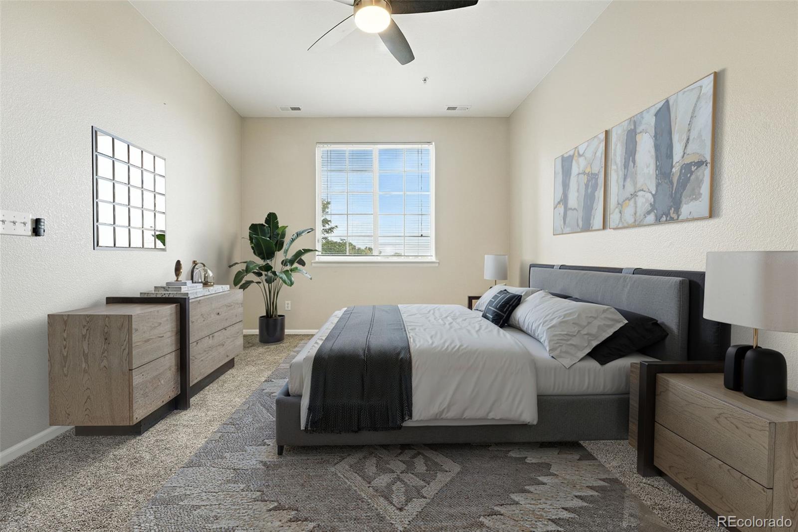 5255 Memphis Street, Unit 312 Denver, CO 80239 - Photo 11 of 40 a bedroom with a bed and a couch