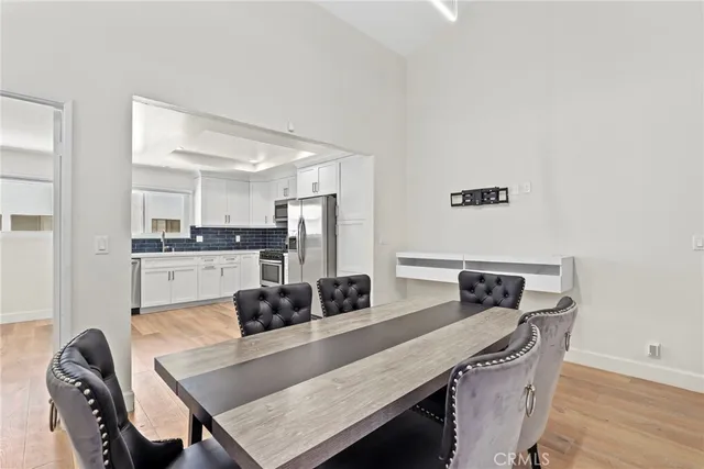 a kitchen with a table and chairs
