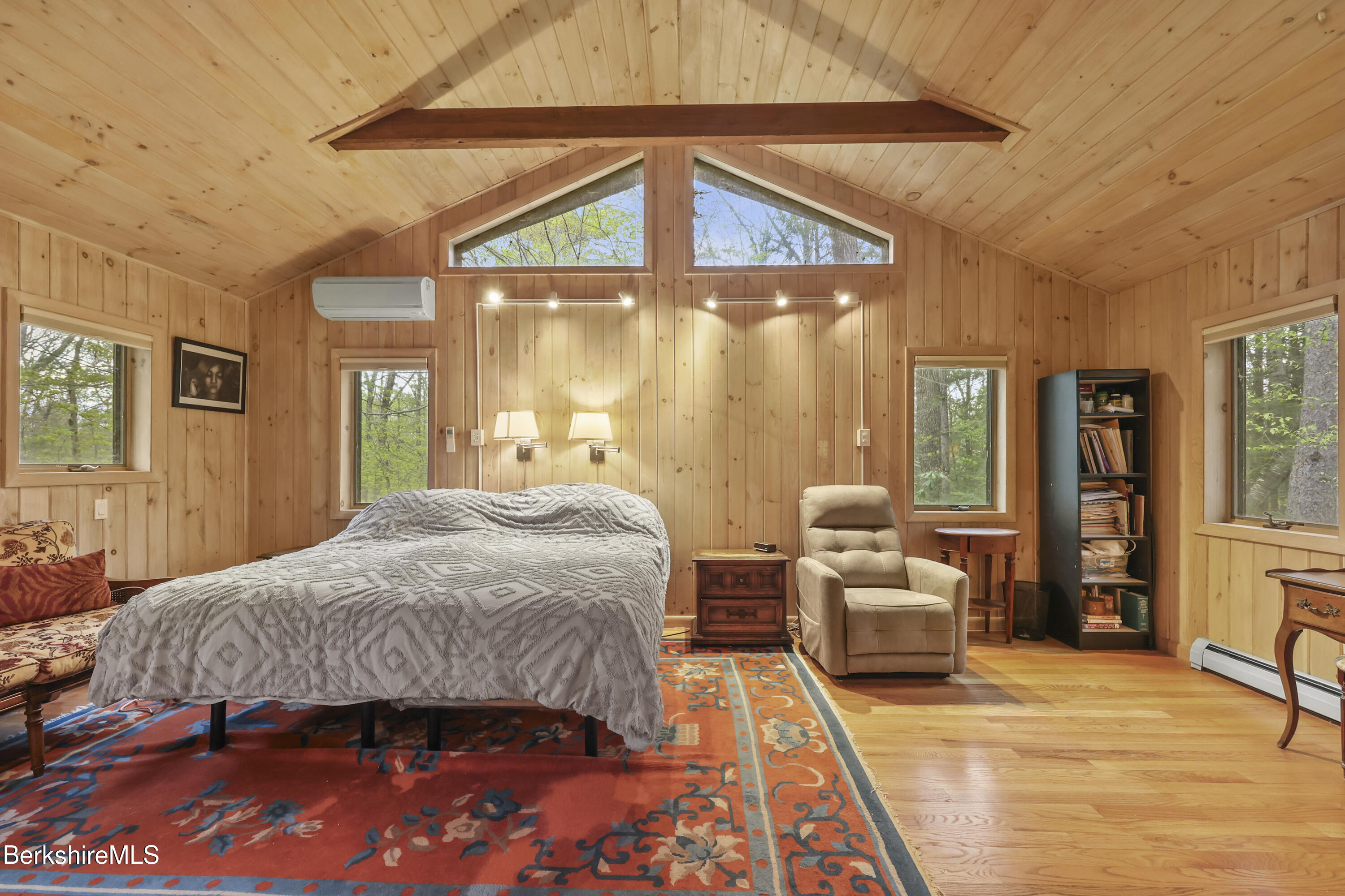 422 Bonny Rigg Hill Road Becket, MA 01223 - Photo 19 of 60 a bedroom with a bed and wooden floor