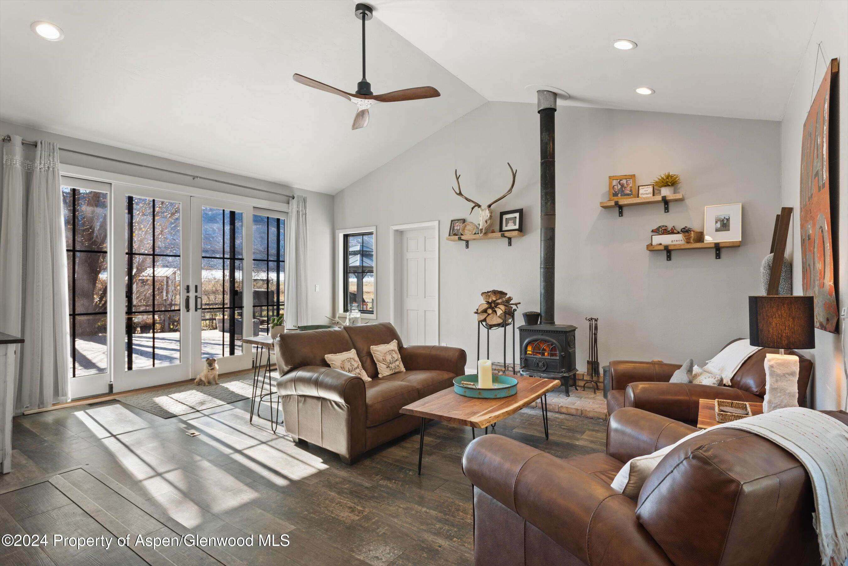 332 Horseshoe Drive Basalt, CO 81621 - Photo 1 of 31 a living room with furniture and a floor to ceiling window
