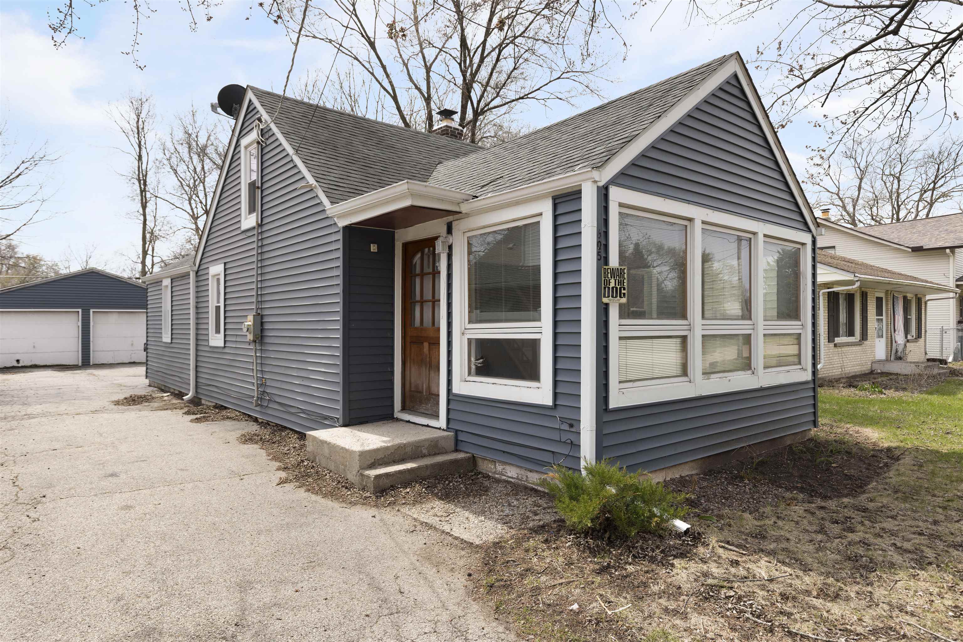 605 Barnum Road Rockford, IL 61109 - Photo 1 of 12 a view of a house with a yard