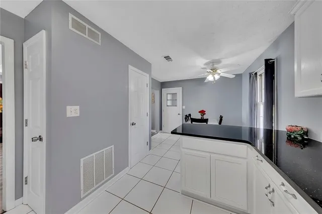 a bed room with a bed and a chandelier