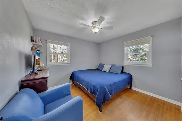a bedroom with a bed furniture and a window