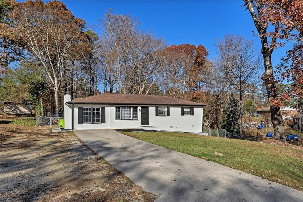 4385 Donegal Circle Lithia Springs, GA 30122 - Photo 2 of 32 a front view of a house with a garden