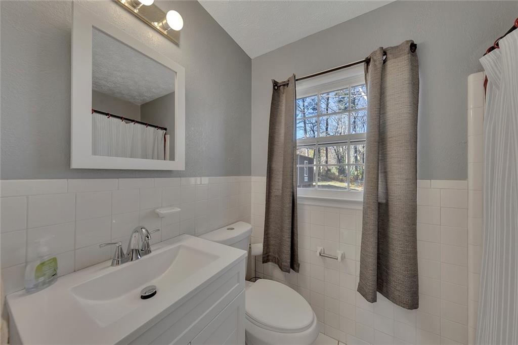 4385 Donegal Circle Lithia Springs, GA 30122 - Photo 21 of 32 a bathroom with a sink toilet and shower