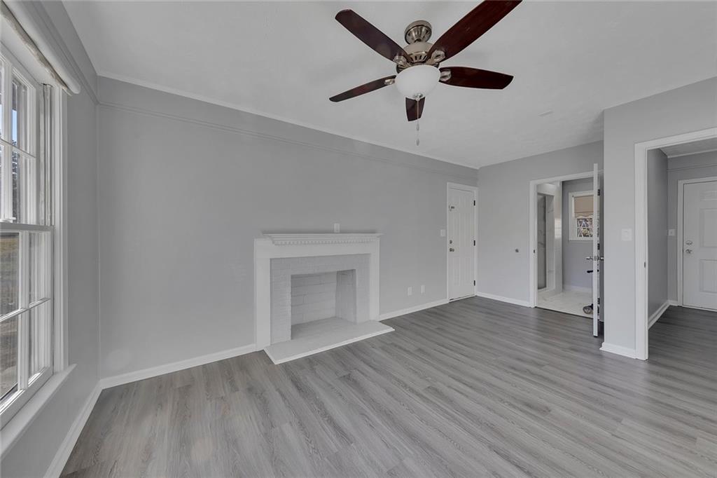 4385 Donegal Circle Lithia Springs, GA 30122 - Photo 23 of 32 an empty room with wooden floor and windows