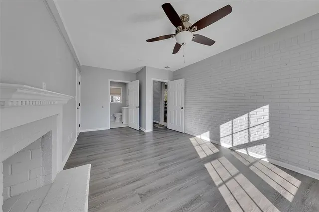 wooden floor in an empty room with a fireplace