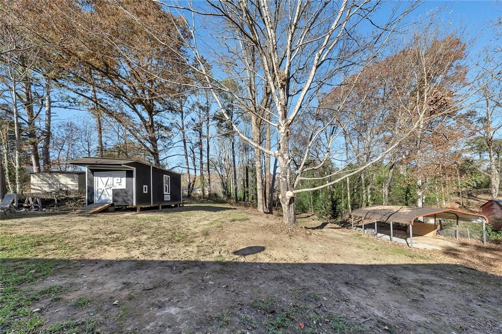 4385 Donegal Circle Lithia Springs, GA 30122 - Photo 29 of 32 a view of a yard with a house