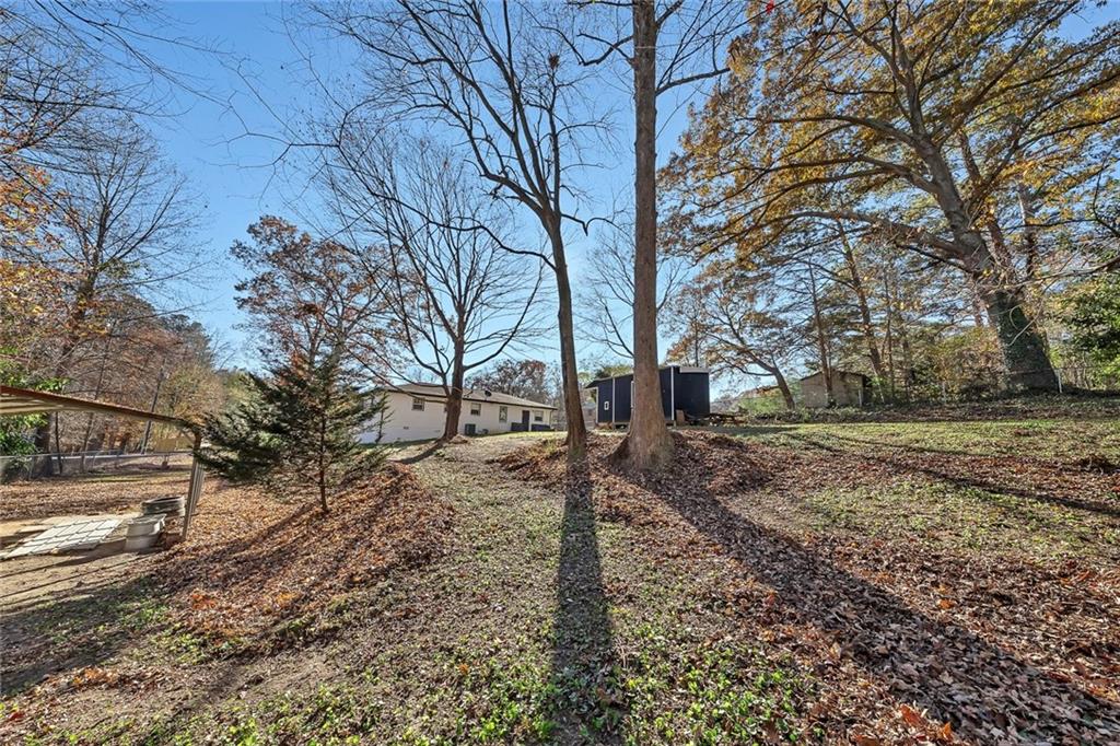 4385 Donegal Circle Lithia Springs, GA 30122 - Photo 31 of 32 a view of a yard with a tree