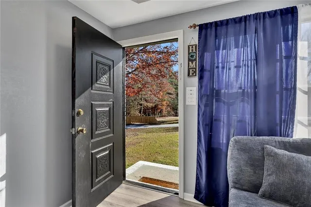 a living room with a couch and a window