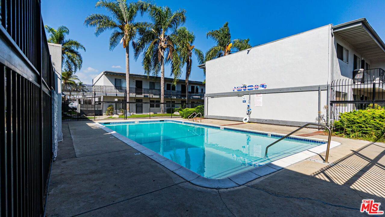 5500 Ackerfield Avenue, Unit 104 Long Beach, CA 90805 - Photo 18 of 19 swimming pool view with a outdoor seating