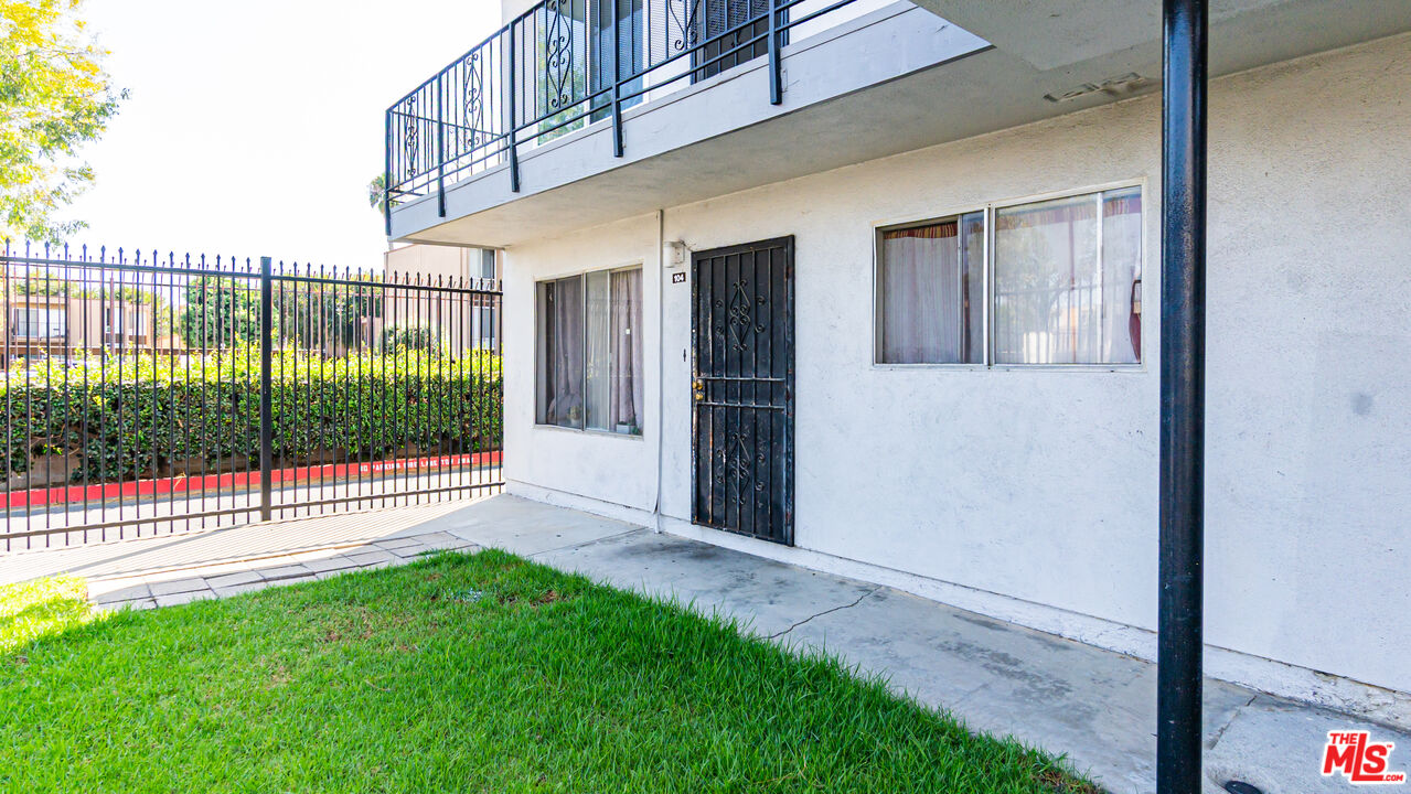 5500 Ackerfield Avenue, Unit 104 Long Beach, CA 90805 - Photo 2 of 19 a view of a backyard with a garden