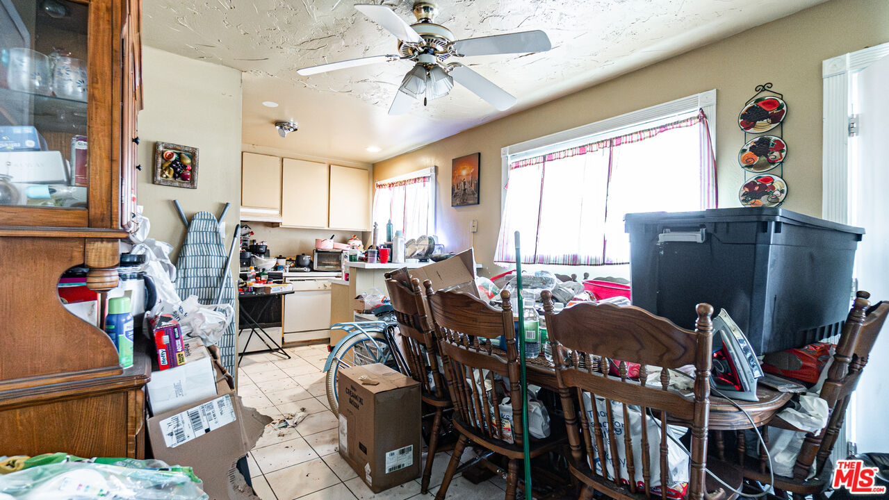 5500 Ackerfield Avenue, Unit 104 Long Beach, CA 90805 - Photo 6 of 19 a view of a dining room with furniture window and outside view