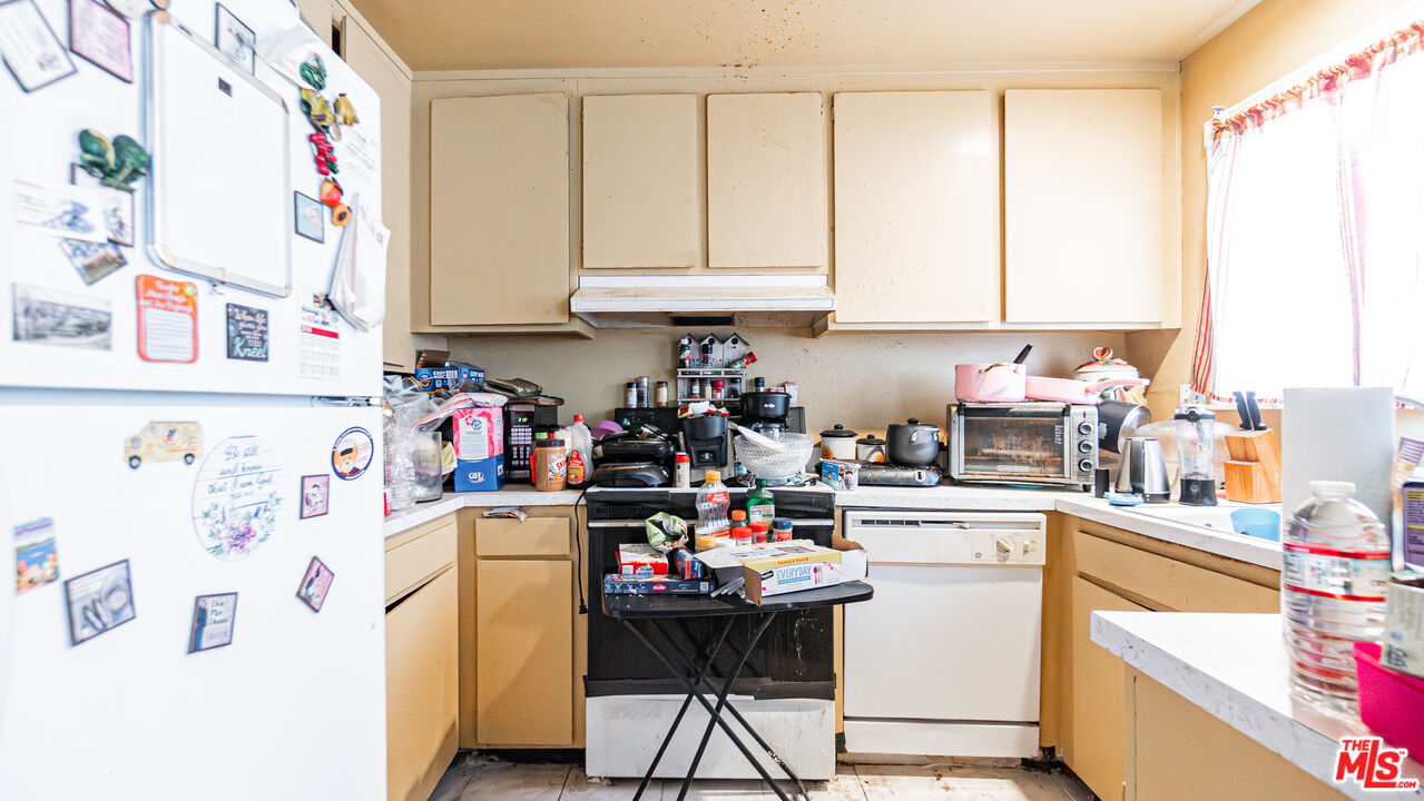 5500 Ackerfield Avenue, Unit 104 Long Beach, CA 90805 - Photo 8 of 19 a room with storage and utility