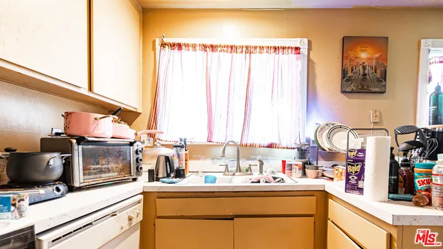 a bathroom with a sink vanity and a mirror