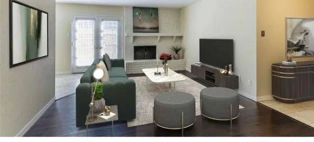 a living room with furniture a fireplace and a flat screen tv