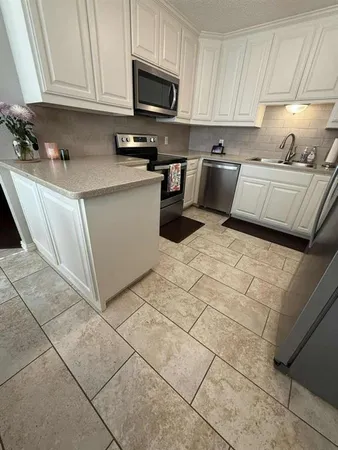 a bedroom with furniture and a mirror