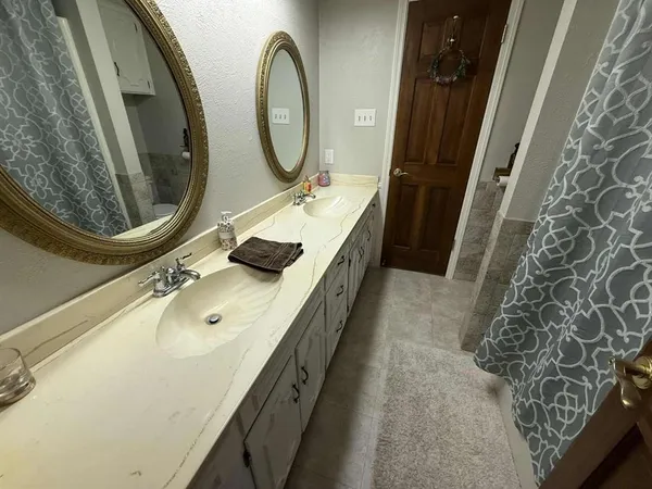 a white toilet sitting next to a bathroom sink
