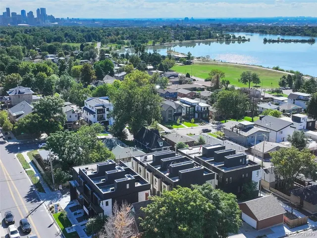 an aerial view of a house with a lake view
