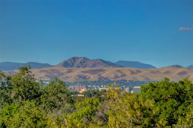 a picture of a bench in front of a wall