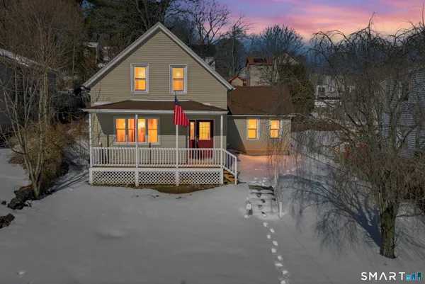 a view of a house with a yard and garage