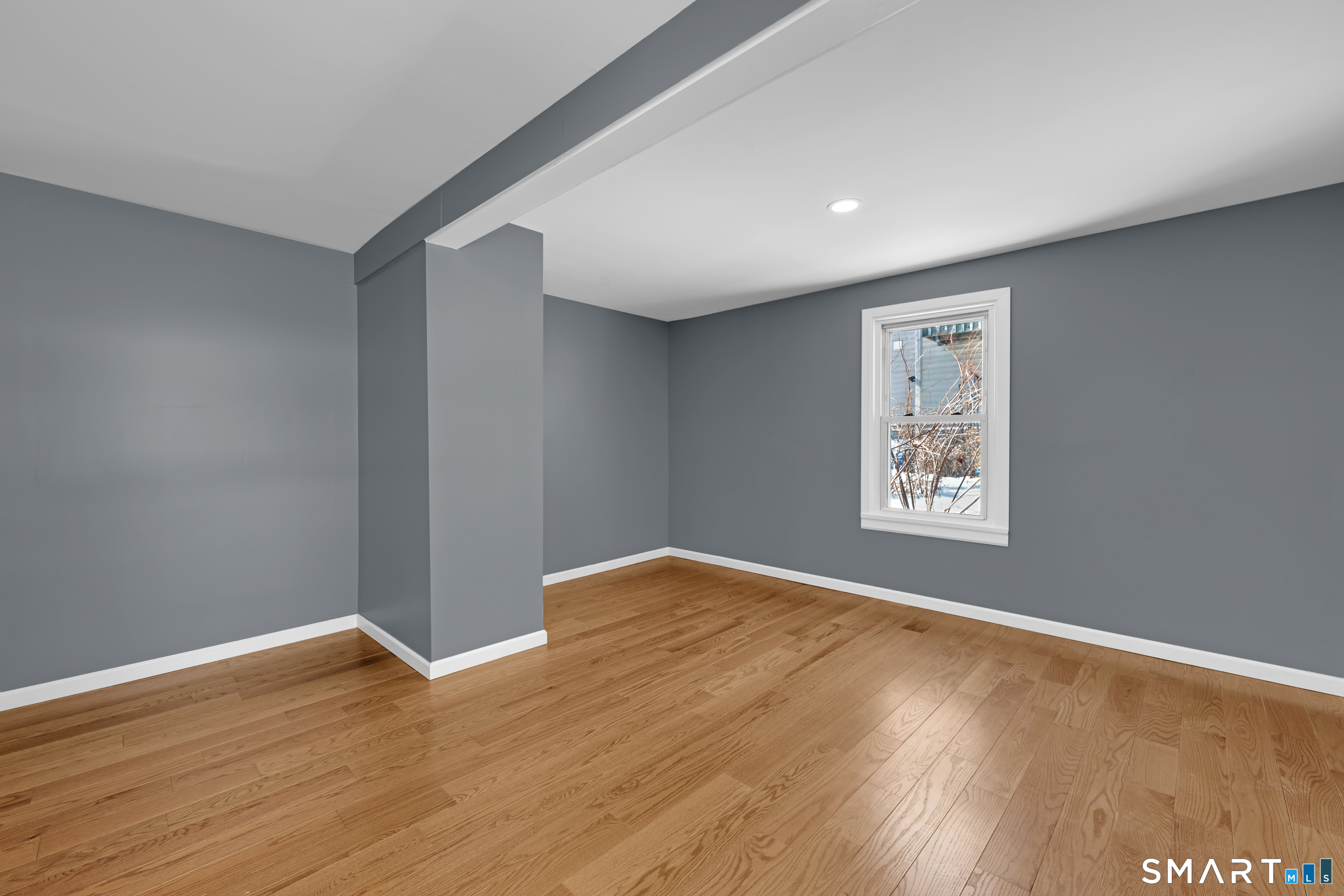 254 Broad Street Norwich, CT 06360 - Photo 11 of 38 a view of an empty room with wooden floor