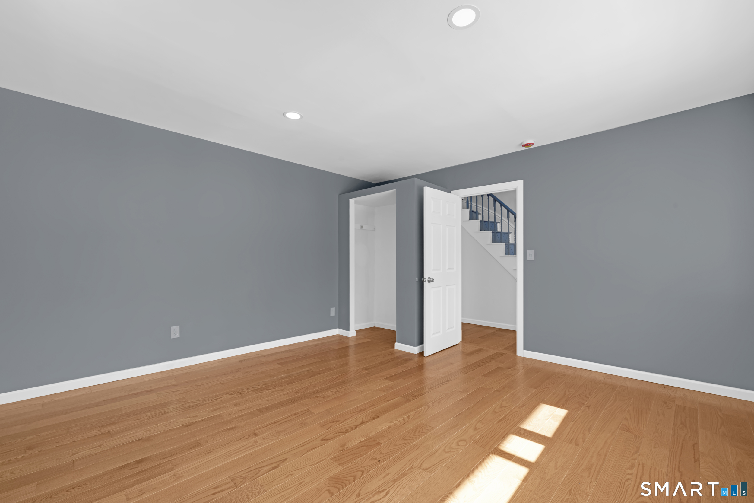 254 Broad Street Norwich, CT 06360 - Photo 15 of 38 a view of an empty room with wooden floor