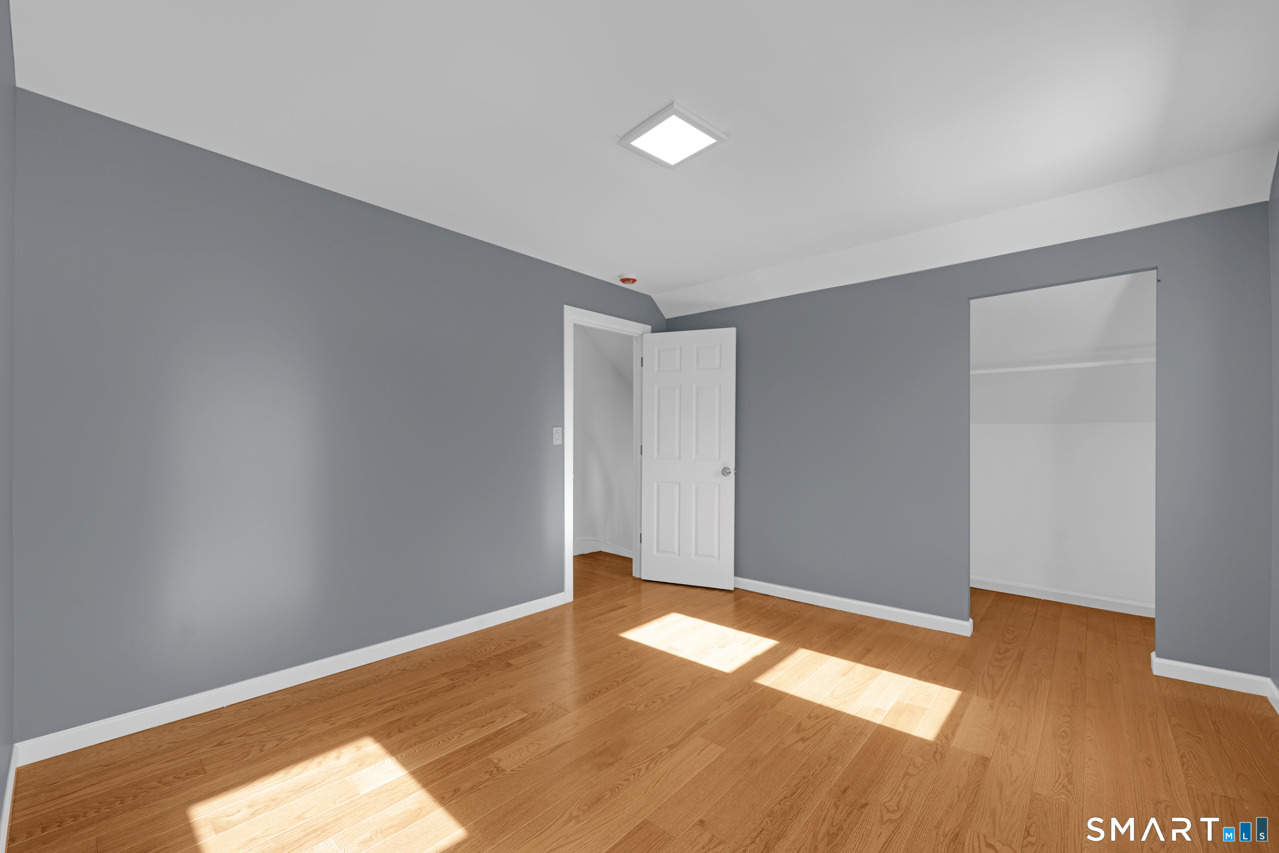 254 Broad Street Norwich, CT 06360 - Photo 20 of 38 a view of empty room with wooden floor