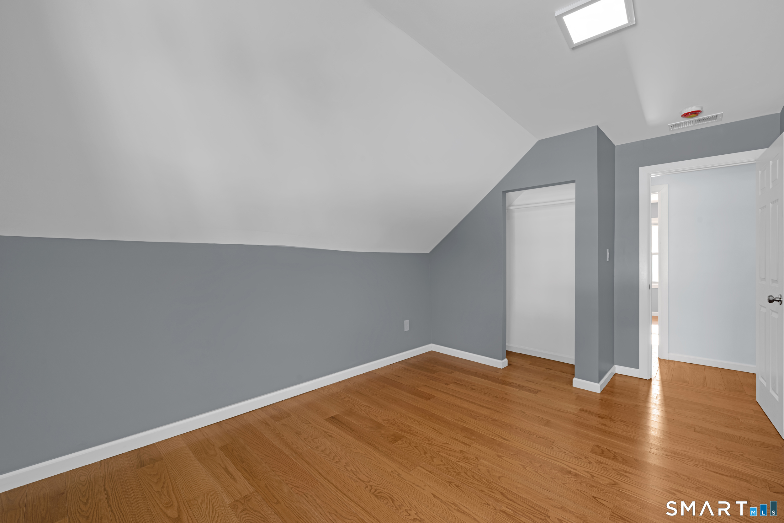 254 Broad Street Norwich, CT 06360 - Photo 22 of 38 a view of empty room with wooden floor