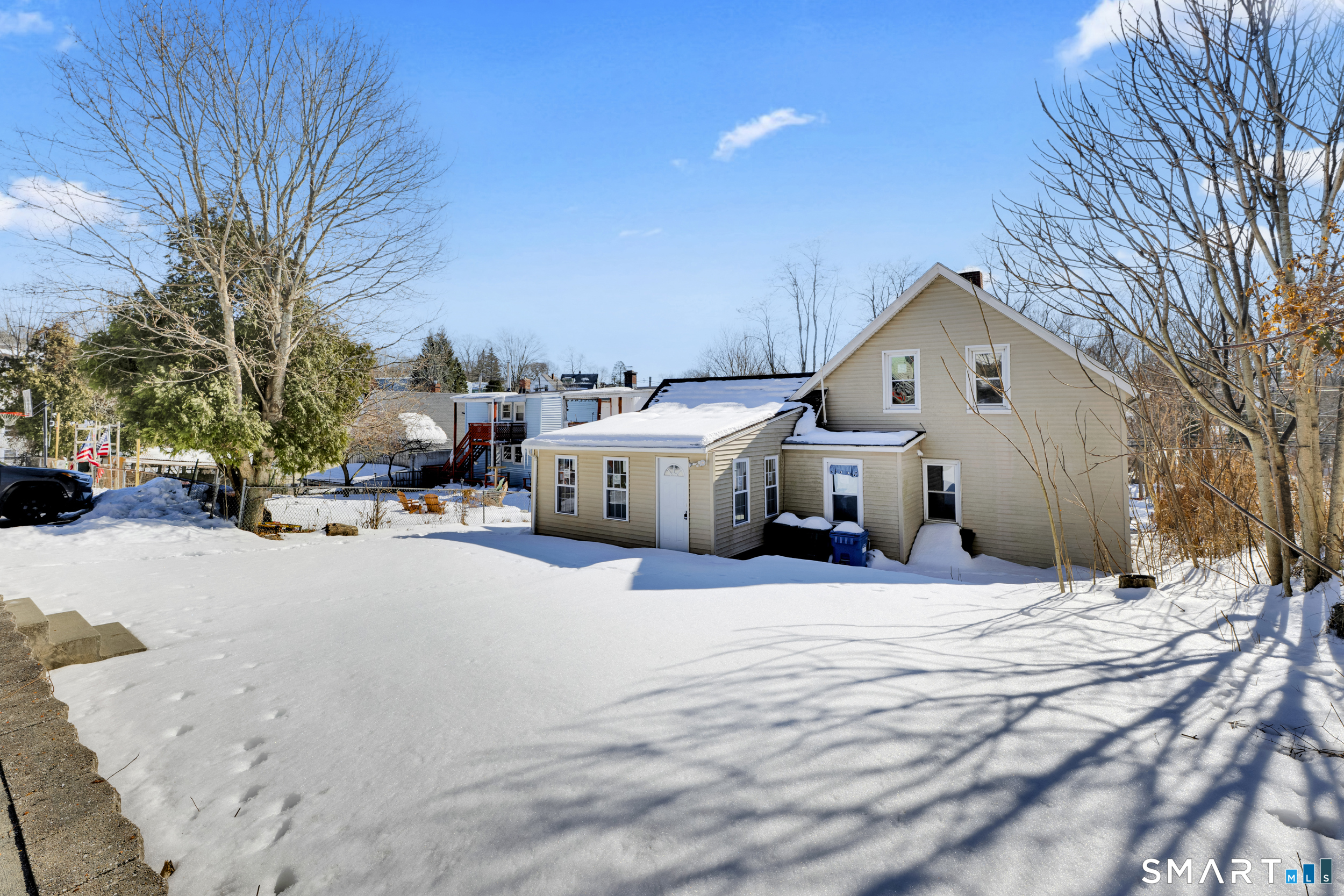 254 Broad Street Norwich, CT 06360 - Photo 30 of 38 a view of a road with a house in the background