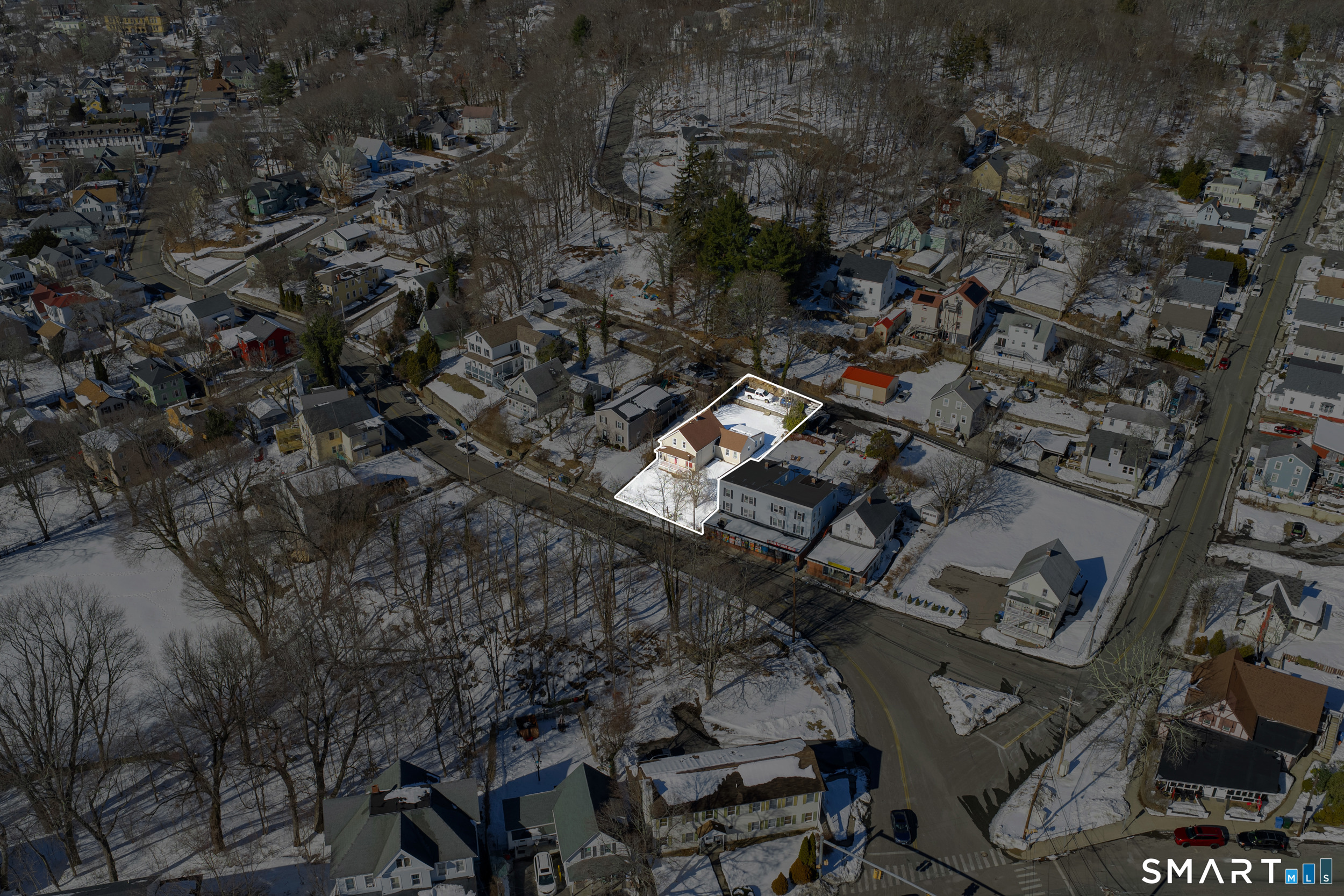 254 Broad Street Norwich, CT 06360 - Photo 37 of 38 an aerial view of multiple houses with yard