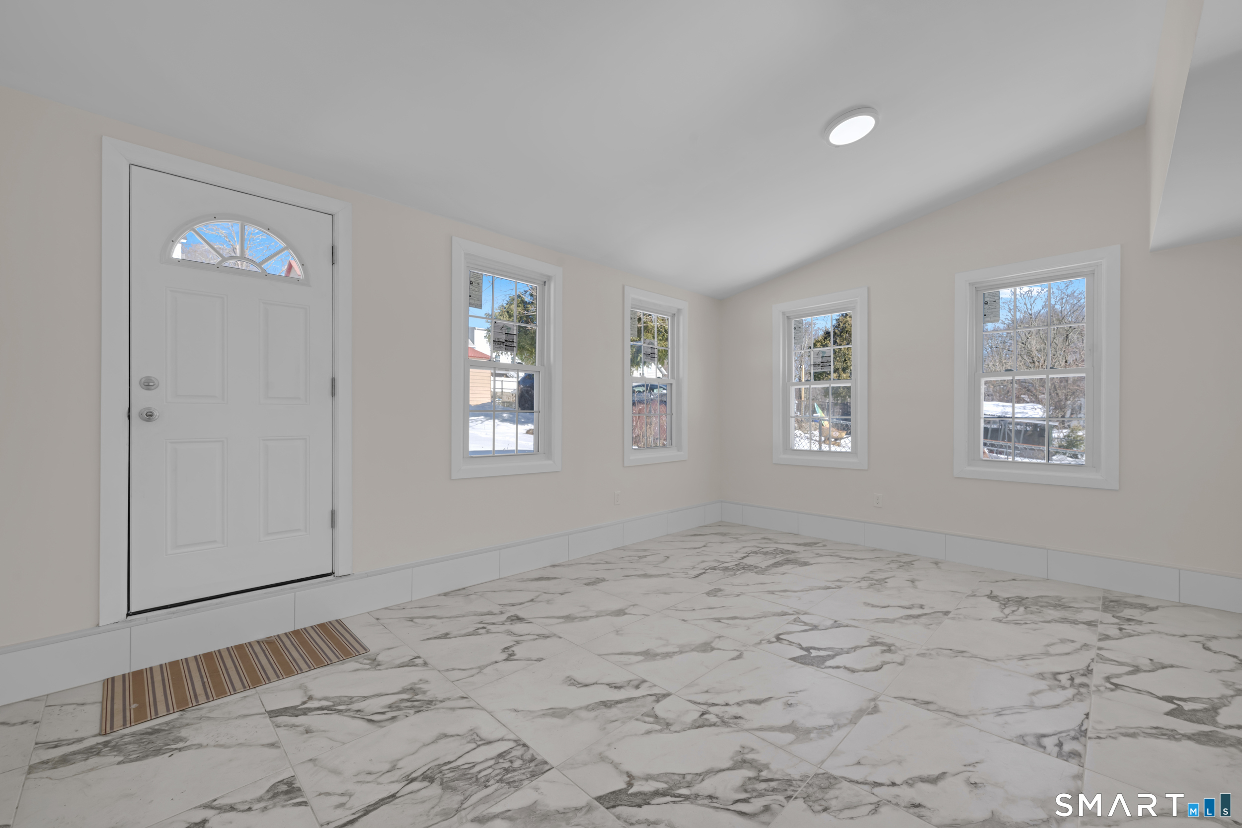 254 Broad Street Norwich, CT 06360 - Photo 4 of 38 a view of an empty room with window and closet