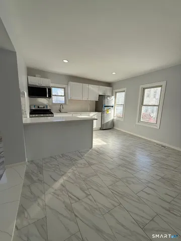 a view of kitchen and microwave