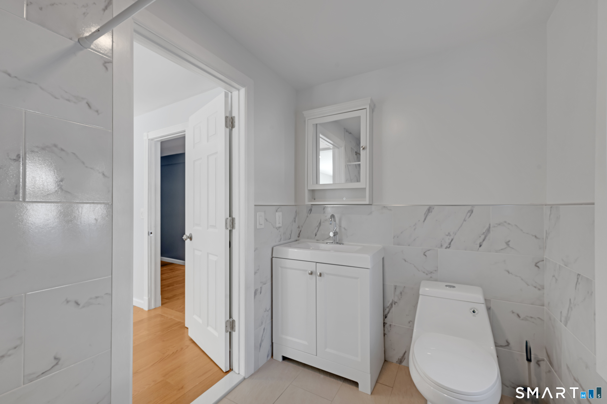 254 Broad Street Norwich, CT 06360 - Photo 9 of 38 a bathroom with a toilet sink and shower